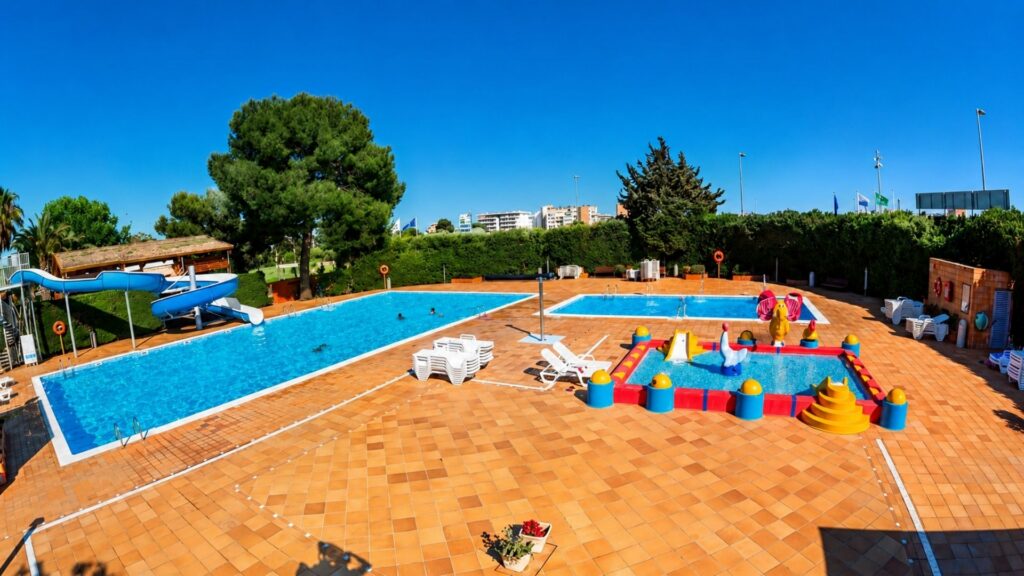 Campground with a pool and water slide in Salou